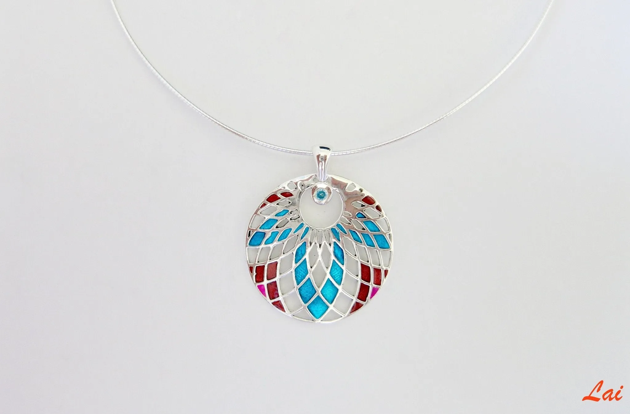 Exquisite, jali cut-out pattern round enamel pendant