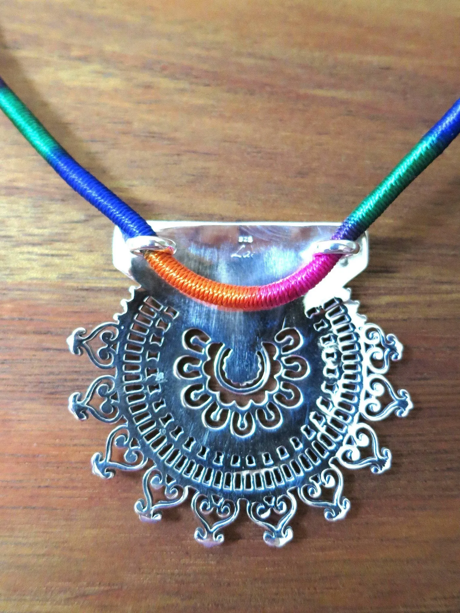 Exquisite, Kutch-inspired, round sunburst jali pendant with hammer finish
