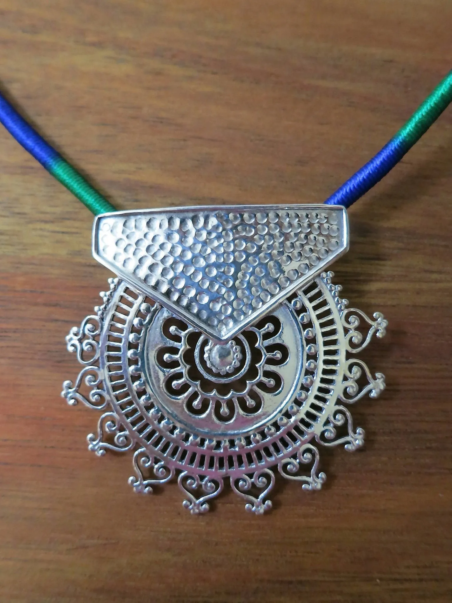 Exquisite, Kutch-inspired, round sunburst jali pendant with hammer finish
