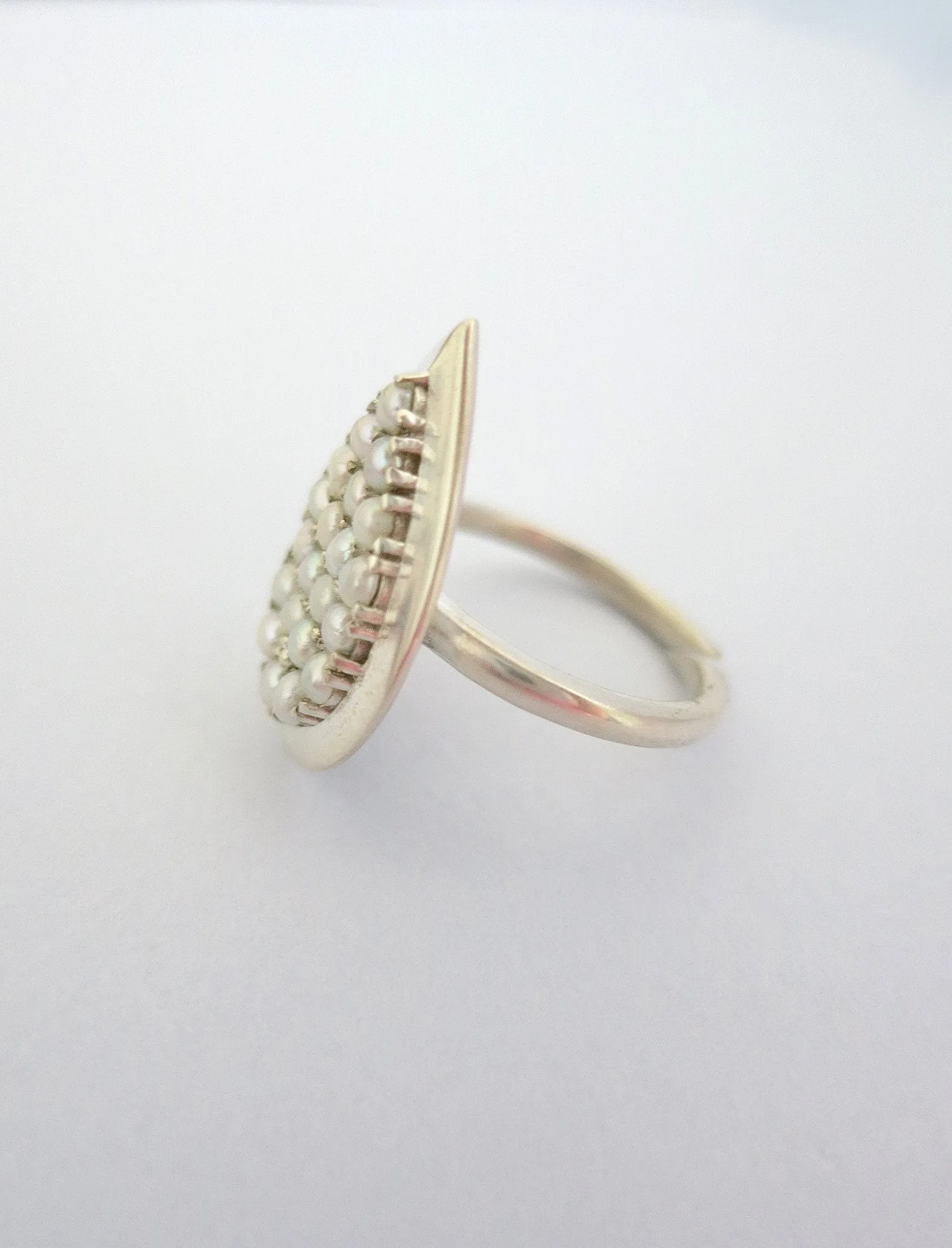 Exquisite, tear-drop shape pearl encrusted ring
